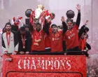 Soccer Football - Premier League - Liverpool Victory Parade - Liverpool, Britain - May 26, 2025 Liverpool's Mohamed Salah celebrates with the trophy and Dominik Szoboszlai, Luis Diaz and Darwin Nunez after winning the Premier League on the bus during the Victory parade REUTERS/Phil Noble  TPX IMAGES OF THE DAY