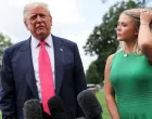 U.S. President Donald Trump speaks with reporters, while White House Press Secretary Karoline Leavitt stands next to him, as he departs for travel to Pennsylvania from the South Lawn at the White House in Washington, D.C. U.S., July 15, 2025. REUTERS/Jonathan Ernst/Jonathan Ernst