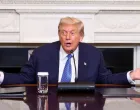 U.S. President Donald Trump gestures during a trilateral signing event with Armenia's Prime Minister Nikol Pashinyan and Azerbaijan's President Ilham Aliyev (not pictured), at the White House, in Washington, D.C., August 8, 2025. REUTERS/Kevin Lamarque/Kevin Lamarque