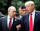 FILE PHOTO: U.S. President Donald Trump and Russia's President Vladimir Putin talk during the family photo session at the APEC Summit in Danang, Vietnam November 11, 2017. REUTERS/Jorge Silva/File Photo/Jorge Silva