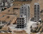 Israeli heavy machinery demolish a Palestinian building near Bethlehem in the Israeli-occupied West Bank August 6,2025. REUTERS/Mussa Qawasma/Mussa Qawasma