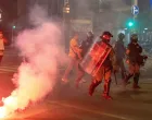 Serbia's police officers intervene to end standoff between ruling party supporters and anti-government protesters in Belgrade, Serbia, August 13, 2025. REUTERS/Djordje Kojadinovic/Djordje Kojadinovic