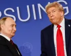 U.S. President Donald Trump looks on next to Russian President Vladimir Putin during a press conference following their meeting to negotiate an end to the war in Ukraine, at Joint Base Elmendorf-Richardson, in Anchorage, Alaska, U.S., August 15, 2025. REUTERS/Kevin Lamarque  TPX IMAGES OF THE DAY/Kevin Lamarque