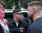 Member of Kneecap Naoise O Caireallain, who performs under the name of Moglai Bap arrives at the Westminster Magistrates' Court, on the day Kneecap member Liam O'Hanna, also known as Liam Og O hAnnaidh and performing under the name of Mo Chara, who has been charged with a terrorism offence in relation to the alleged display of a Hezbollah flag onstage in 2024, appears in court, in London, Britain, August 20, 2025. REUTERS/Hannah McKay/Hannah Mckay