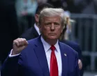 FILE PHOTO: Former U.S. President Donald Trump gestures to his supporters, on the day of the closing arguments in the Trump Organization civil fraud trial, outside a Trump property in the Manhattan borough of New York City, U.S., January 11, 2024. REUTERS/David Dee Delgado/File Photo/David Dee Delgado