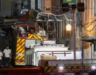 First responders walk at the site of an accident involving Lisbon's Gloria funicular, a popular tourist attraction, which derailed and crashed, resulting in fatalities and injuries, according to authorities, in Lisbon, Portugal, September 3, 2025. REUTERS/Pedro Rocha/Pedro Rocha