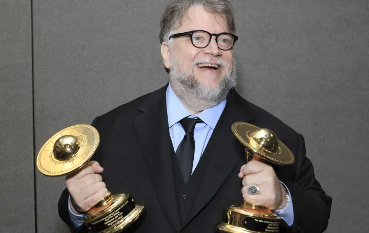 epa10266676 Mexican filmmaker Guillermo Del Toro poses with his awards for Best Film Writing and Best Thriller Film in the press room at the 50th Anniversary Saturn Awards at the Marriott Hotel in Burbank, California, USA, 25 October 2022. The Saturn Awards honors the best in science fiction, fantasy, horror and other genres in film, television, home media releases and theater. EPA/NINA PROMMER/Nina Prommer