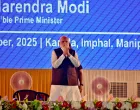 India's Prime Minister Narendra Modi greets supporters upon his arrival at a public meeting in Imphal, in the northeastern state of Manipur, India, September 13, 2025. REUTERS/Stringer/Stringer