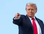 U.S. President Donald Trump gestures, while he boards Air Force One, as he departs for New York at Joint Base Andrews, Maryland, U.S., September 11, 2025. REUTERS/Ken Cedeno  TPX IMAGES OF THE DAY/Ken Cedeno