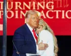U.S. President Donald Trump embraces Erika Kirk, Charlie Kirk's widow, during a memorial service for slain conservative commentator Charlie Kirk at State Farm Stadium, in Glendale, Arizona, U.S., September 21, 2025. REUTERS/Daniel Cole/Daniel Cole