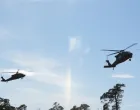 Swedish Army Blackhawk helicopters prepare to land at the Tofta firing range on Gotland, Sweden, September 24, 2025. REUTERS/Tom Little/Tom Little