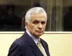 epa08669659 (FILE) - The former speaker of the Bosnian Serb parliament Momcilo Krajisnik enters the courtroom for his appeals verdict at the courtroom of the U.N. Yugoslav war crimes tribunal in the Hague, Netherlands, 17 March 2009 (reissued 15 September 2020). University Clinical Centre in Banja Luka, Bosnia Herzegovina said 15 September 2020 Momcilo Krajisnik, a Bosnian Serb political leader, died of infection with the novel coronavirus at the clinic in Banja Luka, Bosnia Herzegovina. Krajisnik was found guilty in 2006 of committing crimes against humanity during the Bosnian War by the International Criminal Tribunal for the former Yugoslavia (ICTY) and was sentenced to 20 years' imprisonment. He was 01 September 2013 granted early release after serving two thirds of the sentence. EPA/BAS CZERWINSKI/ POOL/Bas Czerwinski/ Pool