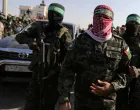 FILE PHOTO: Abu Ubaida, the spokesman of the Izz el-Deen al-Qassam Brigades, walks during an anti-Israel military show by Hamas militants in the southern Gaza Strip November 11, 2019. REUTERS/Ibraheem Abu Mustafa/File Photo/Ibraheem Abu Mustafa