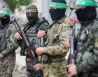 FILE PHOTO: Gunmen stand guard at the funeral of Marwan Issa, a senior Hamas deputy military commander who was killed in an Israeli airstrike during the conflict between Israel and Hamas, amid a ceasefire between Israel and Hamas, in the central Gaza Strip, February 7, 2025. REUTERS/Ramadan Abed/File Photo/Ramadan Abed