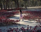 A girl walks through an installation of flowers at the site of the Nova festival where partygoers were killed and kidnapped, on the two-year anniversary of the deadly October 7, 2023 attack on Israel by Hamas from Gaza, in Reim, southern Israel, October 7, 2025. REUTERS/Itay Cohen  TPX IMAGES OF THE DAY/Itay Cohen