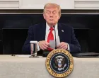 U.S. President Donald Trump holds a note that was handed to him by U.S. Secretary of State Marco Rubio during a roundtable on antifa, an anti-fascist movement Trump designated a domestic "terrorist organization" via executive order on September 22, at the White House in Washington, D.C., U.S., October 8, 2025. REUTERS/Evelyn Hockstein  TPX IMAGES OF THE DAY/Evelyn Hockstein