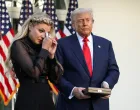 Erika Kirk, wife of slain conservative commentator Charlie Kirk, reacts next to U.S. President Donald Trump during a ceremony to posthumously award the Medal of Freedom to Charlie Kirk, at the White House in Washington, D.C., U.S., October 14, 2025. REUTERS/Kevin Lamarque/Kevin Lamarque