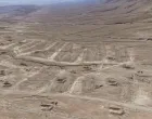 A drone view of the mass grave site in the desert near the eastern Syrian town of Dhumair, February 27, 2025. A Reuters investigation found that the Assad government secretly trucked thousands of bodies there from an exposed mass grave in the Damascus suburb of Qutayfah from 2019-2021. REUTERS/Khalil Ashawi/Khalil Ashawi