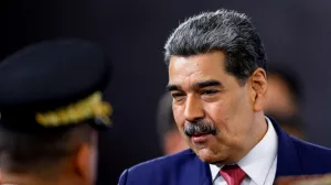 FILE PHOTO: Venezuela's President Nicolas Maduro prepares to leave at the end of a press conference, days after he said Venezuela would deploy military, police and civilian defenses at 284 "battlefront" locations across the country, amid heightened tensions with the U.S., in Caracas, Venezuela, September 15, 2025. REUTERS/Leonardo Fernandez Viloria/File Photo/Leonardo Fernandez Viloria