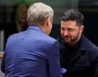 Ukrainian President Volodymyr Zelenskiy is welcomed by Poland's Prime Minister Donald Tusk at the European Union leaders' summit in Brussels, Belgium October 23, 2025. REUTERS/Yves Herman/Pool/Yves Herman