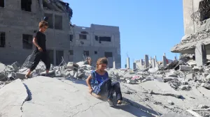 Children play on the rubble of destroyed homes at Al-Shati refugee camp, amid a ceasefire between Israel and Hamas, in Gaza City, October 26, 2025. REUTERS/Ebrahim Hajjaj/Ebrahim Hajjaj