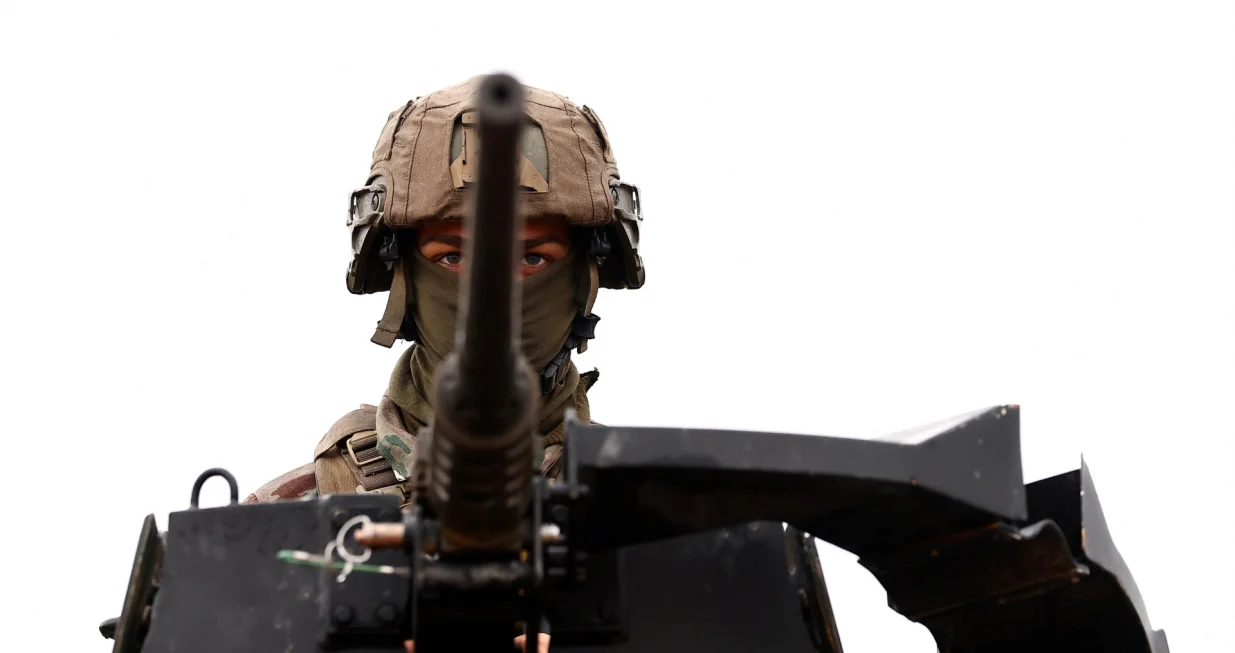 A soldier is perched atop an Armored Forward Vehicle (VAB) during a demonstration as part of a 'day dedicated to artillery' organized by military defense system supplier KNDS France at the French military camp of Canjuers, in the Var department, France, on October 20, 2025. REUTERS/Manon Cruz/Manon Cruz