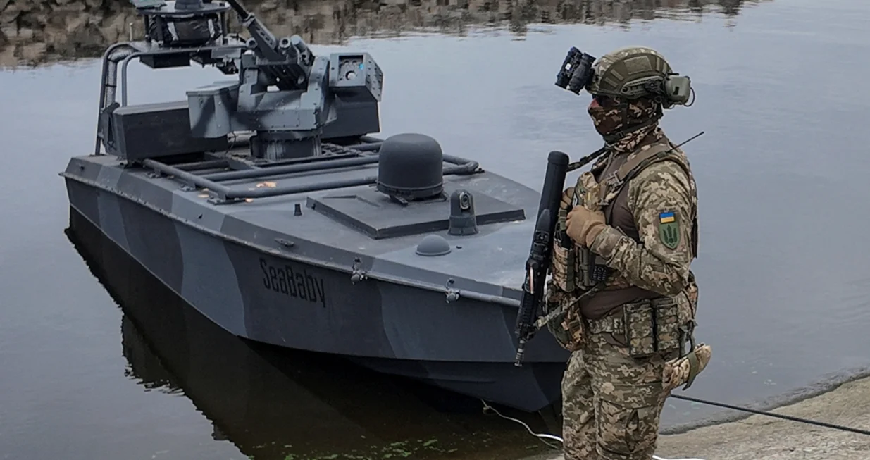 A serviceman of Ukraine's Security Service (SBU) stands guard near the latest version of its "sea baby" naval drone, amid Russia's attack on Ukraine, in an undisclosed location in Ukraine October 17, 2025. REUTERS/Vlad Smilianets/Vlad Smilianets