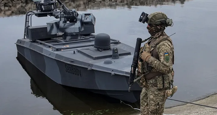 A serviceman of Ukraine's Security Service (SBU) stands guard near the latest version of its "sea baby" naval drone, amid Russia's attack on Ukraine, in an undisclosed location in Ukraine October 17, 2025. REUTERS/Vlad Smilianets/Vlad Smilianets