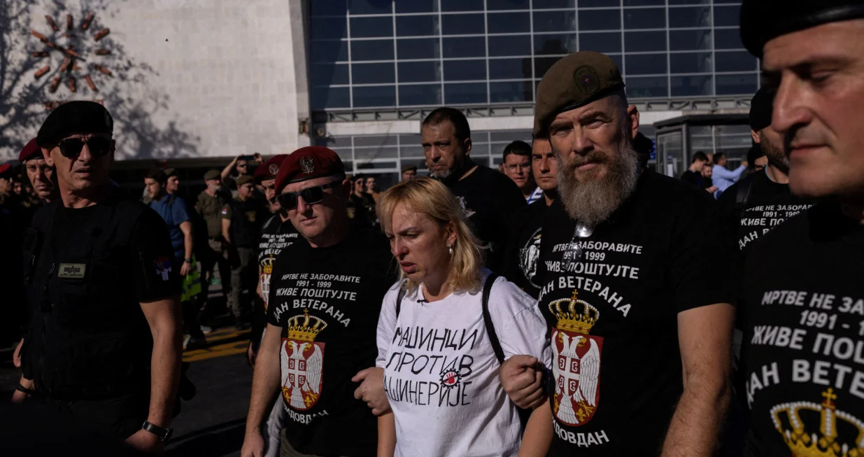Dijana Hrka, mother of Stefan Hrka, one of the victims, surrounded by war veterans, leaves the Novi Sad railway station during the first anniversary of the fatal November 2024 railway station canopy collapse, which killed 16 people, triggering nationwide accusations of widespread corruption and negligence, in Novi Sad, Serbia, November 1, 2025. REUTERS/Alkis Konstantinidis/Alkis Konstantinidis