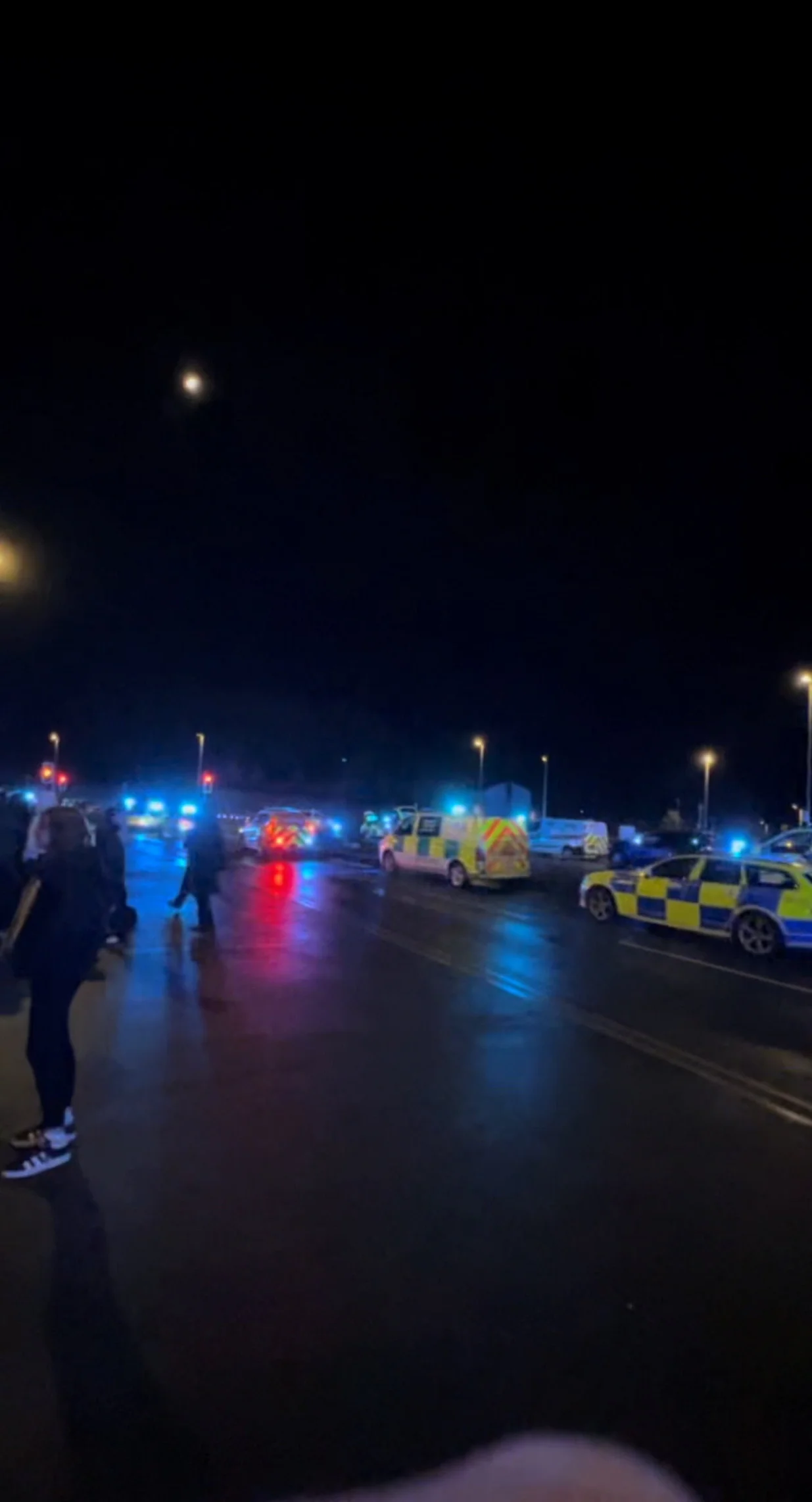 Police vehicles and ambulances outside a train station following a stabbing incident, in Huntingdon, Britain, November 1, 2025, in this screengrab obtained from a social media video. @_ACC5_/via REUTERS THIS IMAGE HAS BEEN SUPPLIED BY A THIRD PARTY. MANDATORY CREDIT. NO RESALES. NO ARCHIVES. VERIFICATION: Reuters was able to confirm the location and date of the footage by original file metadata from the source./@_acc5_