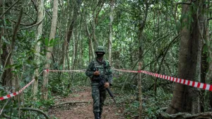 FILE PHOTO: Person from Thai military walks near Thai-Cambodian border at Chong Chub Ta Mok area, where landmines were found deployed, following a ceasefire between Cambodia and Thailand, in Surin Province, Thailand, August 20, 2025. REUTERS/Chalinee Thirasupa/File Photo/Chalinee Thirasupa