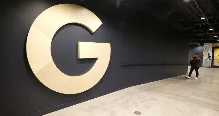 epa09952089 Google logo in the hallway during a media tour in Mountain View, California, USA, 16 May 2022. Google announced on 16 May the opening of its new Bay View campus in Silicon Valley, representing the company's first time developing its own major campus and the largest to pursue multiple green building certifications. The Bay View campus was designed by architects Bjarke Ingels Group (BIG) and Heatherwick Studio, as well as Google's design and engineering teams and spans 42 acres adjacent to the open space, two office buildings, and 1,00-person event center, and 240 short-term employee accommodations units. The campus incorporates biophilic design principles, including greenery, natural daylight and views outside from every desk to improve the health and wellbeing of those inside the building. The new building is to operate every hour of every day on carbon-free energy by 2030, the first-of-its-kind dragonscale solar skin, as well as nerby wind farms, will power Bay View on carbon-free energy 90 percent of the time. Bay View is 100 percent electric where even the kitchens are electric to decrease carbon emissions. To help deliver on its commitment to replenish 120 percent of the water it comsumes by 2023, the site is net water-positive with all non-potable water demands being met using the recycled water it generates on site. A series of above-ground ponds gather rainwater, combine with building wastewater treatment systems, together serve as a water source for cooling towers, flushing toilets, and landscape irrigation. EPA/JOHN G. MABANGLO/John G. Mabanglo