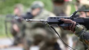 A recruit shoots his G-36 rifle at live-fire training during a media day at the Reconnaissance Battalion, as the German army showcases its new six-month basic training program designed to prepare soldiers for homeland defence and NATO operations, in Ahlen, Germany, November 13, 2025. REUTERS/Leon Kuegeler/Leon Kuegeler