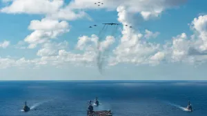 The U.S. Navy's Gerald R. Ford Carrier Strike Group, including the flagship USS Gerald R. Ford, USS Winston S. Churchill, USS Mahan and USS Bainbridge, sail towards the Caribbean Sea under F/A-18E/F Super Hornets and a U.S. Air Force B-52 Stratofortress, in the Atlantic Ocean November 13, 2025. U.S. Navy/Petty Officer 3rd Class Gladjimi Balisage/Handout via REUTERS. THIS IMAGE HAS BEEN SUPPLIED BY A THIRD PARTY/Us Navy