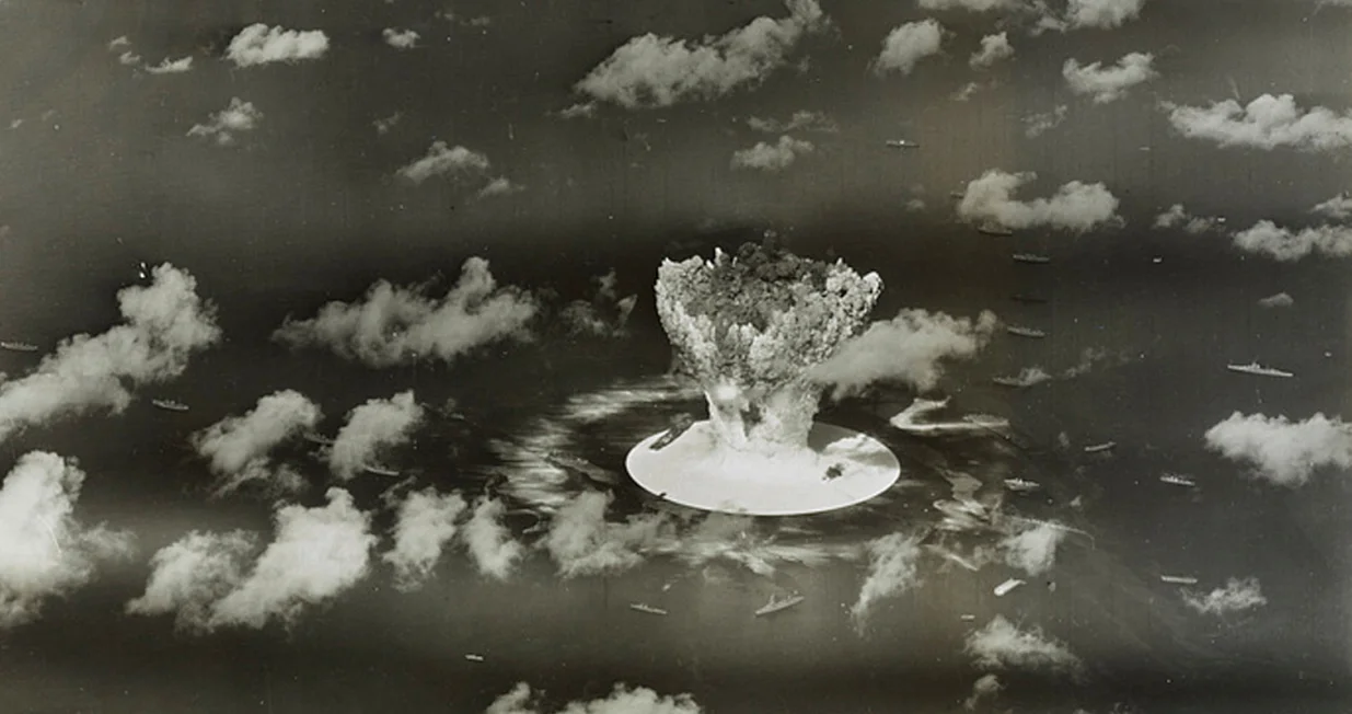 FILE PHOTO: A mushroom cloud rises with ships below during Operation Crossroads nuclear weapons test on Bikini Atoll, Marshall Islands in this 1946 handout provided by the U.S. Library of Congress. The United States said on April 25, 2014, it was examining lawsuits filed by the Marshall Islands against it and eight other nuclear-armed countries that accuse them of failing in their obligation to negotiate nuclear disarmament. REUTERS/U.S. Library of Congress/Handout via Reuters (MARSHALL ISLANDS - Tags: POLITICS MILITARY CONFLICT) ATTENTION EDITORS - FOR EDITORIAL USE ONLY. NOT FOR SALE FOR MARKETING OR ADVERTISING CAMPAIGNS. THIS PICTURE WAS PROVIDED BY A THIRD PARTY. REUTERS IS UNABLE TO INDEPENDENTLY VERIFY THE AUTHENTICITY, CONTENT, LOCATION OR DATE OF THIS IMAGE. THIS PICTURE IS DISTRIBUTED EXACTLY AS RECEIVED BY REUTERS, AS A SERVICE TO CLIENTS/File Photo/Handout.