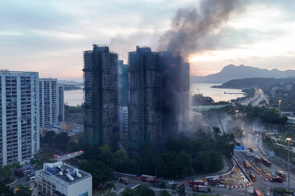 A drone view shows flames and thick smoke rising from the Wang Fuk Court housing estate during a major fire, in Tai Po, Hong Kong, China, November 27, 2025. REUTERS/Tyrone Siu/Tyrone Siu