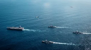 The U.S. Navy's Gerald R. Ford Carrier Strike Group, including the flagship USS Gerald R. Ford, USS Winston S. Churchill, USS Mahan and USS Bainbridge, sail towards the Caribbean Sea under F/A-18E/F Super Hornets and a U.S. Air Force B-52 Stratofortress, in the Atlantic Ocean November 13, 2025. U.S. Navy/Petty Officer 3rd Class Tajh Payne/Handout via REUTERS. THIS IMAGE HAS BEEN SUPPLIED BY A THIRD PARTY/Us Navy