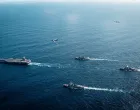 The U.S. Navy's Gerald R. Ford Carrier Strike Group, including the flagship USS Gerald R. Ford, USS Winston S. Churchill, USS Mahan and USS Bainbridge, sail towards the Caribbean Sea under F/A-18E/F Super Hornets and a U.S. Air Force B-52 Stratofortress, in the Atlantic Ocean November 13, 2025. U.S. Navy/Petty Officer 3rd Class Tajh Payne/Handout via REUTERS. THIS IMAGE HAS BEEN SUPPLIED BY A THIRD PARTY/Us Navy