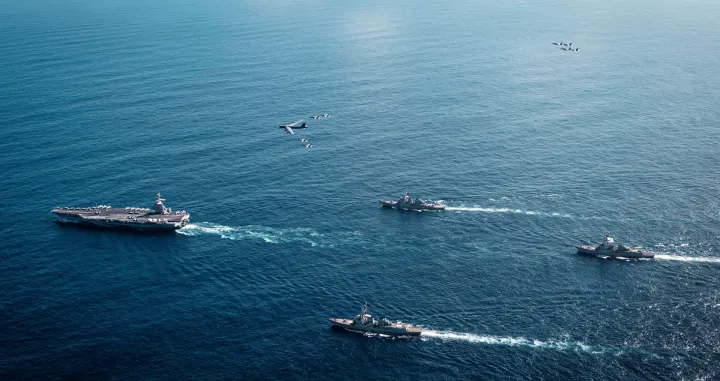 The U.S. Navy's Gerald R. Ford Carrier Strike Group, including the flagship USS Gerald R. Ford, USS Winston S. Churchill, USS Mahan and USS Bainbridge, sail towards the Caribbean Sea under F/A-18E/F Super Hornets and a U.S. Air Force B-52 Stratofortress, in the Atlantic Ocean November 13, 2025. U.S. Navy/Petty Officer 3rd Class Tajh Payne/Handout via REUTERS. THIS IMAGE HAS BEEN SUPPLIED BY A THIRD PARTY/Us Navy