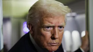 U.S. President Donald Trump looks on aboard Air Force One during travel to Palm Beach, Florida, from Joint Base Andrews, Maryland, U.S., November 25, 2025. REUTERS/Anna Rose Layden/Anna Rose Layden