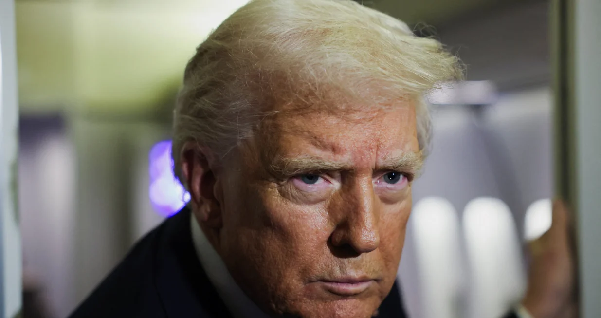 U.S. President Donald Trump looks on aboard Air Force One during travel to Palm Beach, Florida, from Joint Base Andrews, Maryland, U.S., November 25, 2025. REUTERS/Anna Rose Layden/Anna Rose Layden