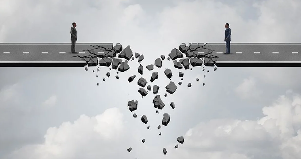 Business deal failure concept as two businessmen on a road bridge that is breaking down and disconnecting as a failing corporate relationship crisis symbol./