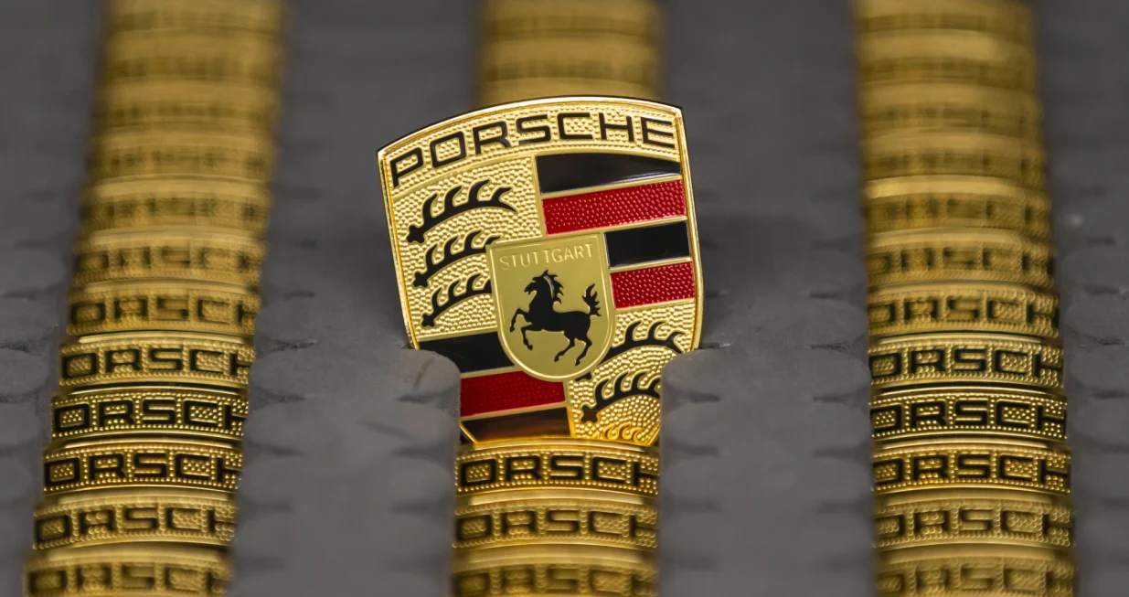 epa08271941 A view of a Logo at the production of Taycan electric sports cars at an assembly line at the German car manufacturer Porsche in Stuttgart, Germany, 05 March 2020. Porsche AG is a listed German manufacturer of luxury sports cars, SUVs and sedans based in Stuttgart. Porsche AG will present the results of the 2020 financial year at the annual press conference on 24 March 2020. EPA/RONALD WITTEK/Ronald Wittek
