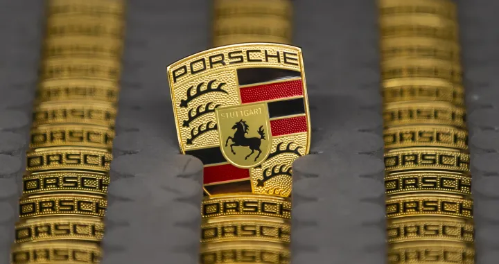 epa08271941 A view of a Logo at the production of Taycan electric sports cars at an assembly line at the German car manufacturer Porsche in Stuttgart, Germany, 05 March 2020. Porsche AG is a listed German manufacturer of luxury sports cars, SUVs and sedans based in Stuttgart. Porsche AG will present the results of the 2020 financial year at the annual press conference on 24 March 2020. EPA/RONALD WITTEK/Ronald Wittek