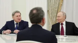 Russian President Vladimir Putin and foreign policy aide Yuri Ushakov attend a meeting with U.S. President Donald Trump's special envoy Steve Witkoff at the Kremlin in Moscow, Russia, December 2, 2025. Sputnik/Alexander Kazakov/Pool via REUTERS ATTENTION EDITORS - THIS IMAGE WAS PROVIDED BY A THIRD PARTY./Alexander Kazakov