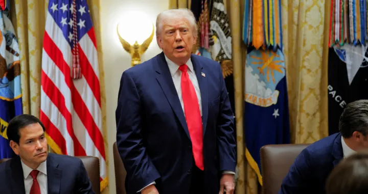 U.S. President Donald Trump, wearing band-aids on his hand, attends a cabinet meeting at the White House in Washington, D.C., U.S., December 2, 2025. REUTERS/Brian Snyder/Brian Snyder