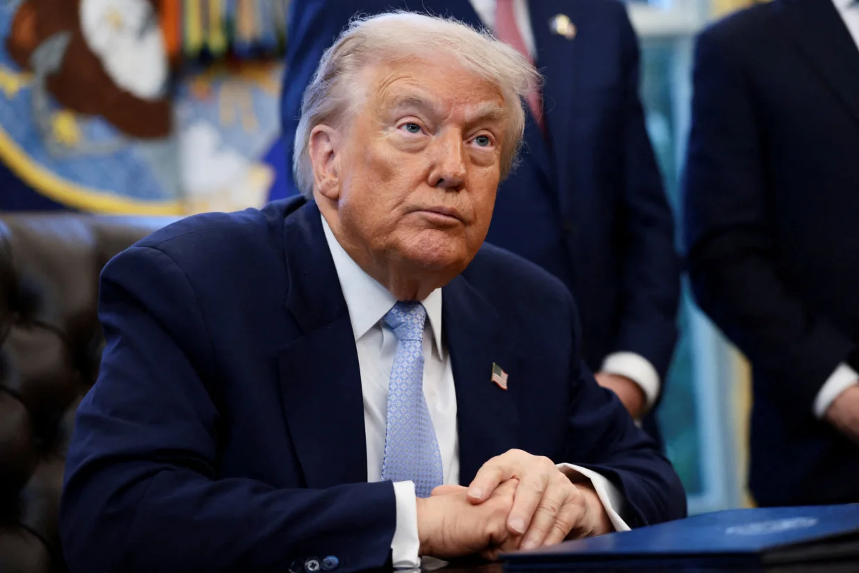 FILE PHOTO: U.S. President Donald Trump looks on as he meets with the White House Task Force on the FIFA World Cup 2026 in the Oval Office at the White House in Washington, D.C., U.S., November 17, 2025. REUTERS/Evelyn Hockstein/File Photo/Evelyn Hockstein