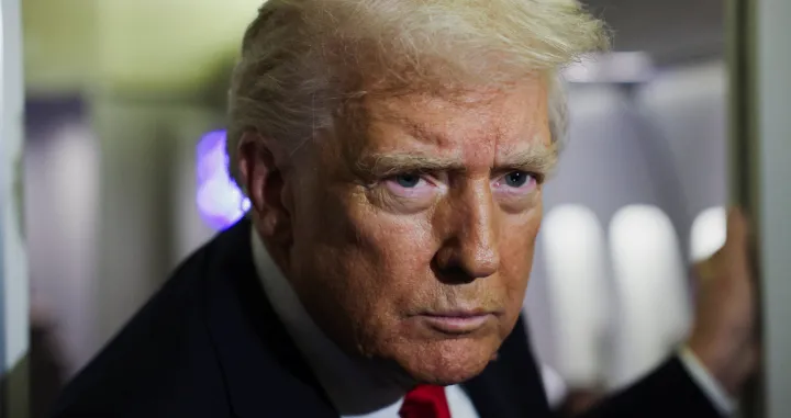 U.S. President Donald Trump looks on aboard Air Force One during travel to Palm Beach, Florida, from Joint Base Andrews, Maryland, U.S., November 25, 2025. REUTERS/Anna Rose Layden/Anna Rose Layden