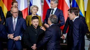 Ukraine's President Volodymyr Zelenskiy and U.S. Special Envoy Steve Witkoff talk to each other as Jared Kushner, the son-in-law of U.S. President Donald Trump, German Chancellor Friedrich Merz and European Commission President Ursula von der Leyen look on following a family photo opportunity at the Chancellery in Berlin, Germany, December 15, 2025. Kay Nietfeld/Pool via REUTERS/Kay Nietfeld