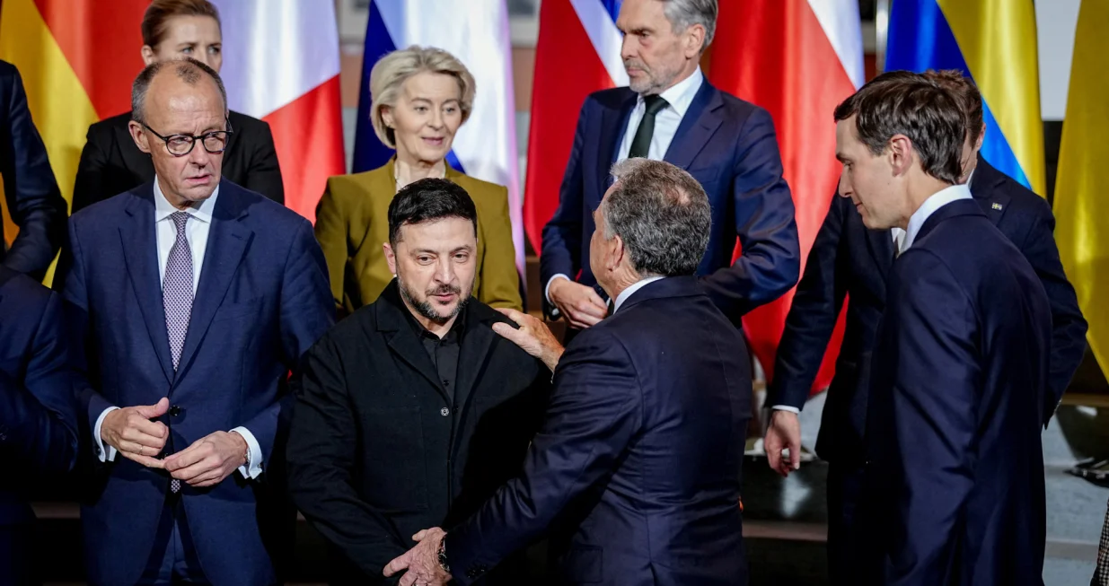 Ukraine's President Volodymyr Zelenskiy and U.S. Special Envoy Steve Witkoff talk to each other as Jared Kushner, the son-in-law of U.S. President Donald Trump, German Chancellor Friedrich Merz and European Commission President Ursula von der Leyen look on following a family photo opportunity at the Chancellery in Berlin, Germany, December 15, 2025. Kay Nietfeld/Pool via REUTERS/Kay Nietfeld